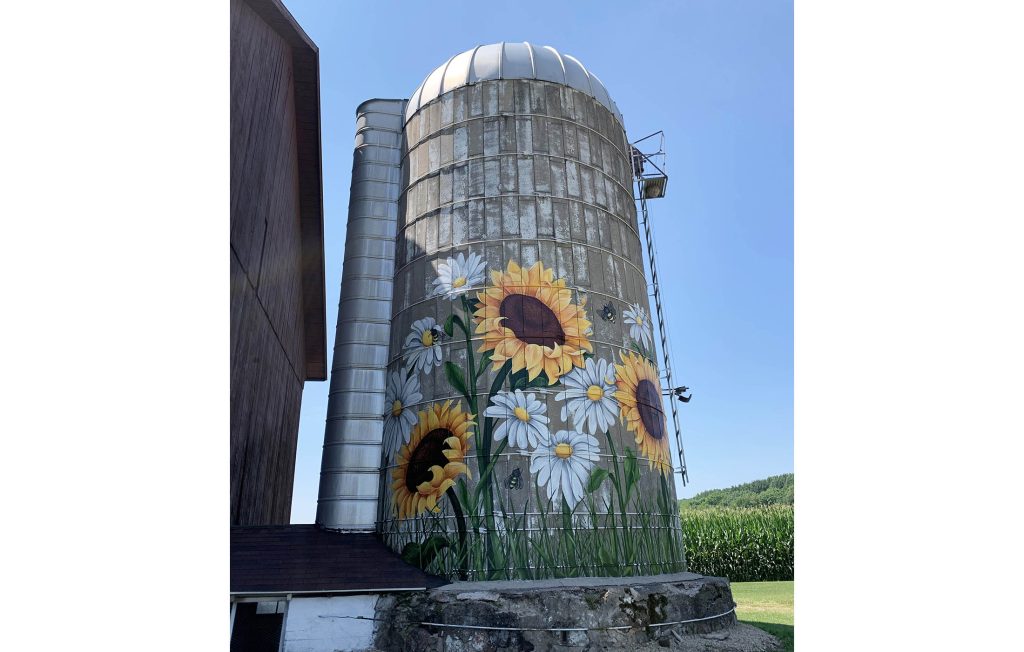 Radies Silo, 2021, Golden Mural Acrylic Paint and Varnish on Concrete, 15’ x 15’, Marion, WI. This mural was a private commission located in rural Wisconsin that accompanies the natural  beauty of the local landscape.