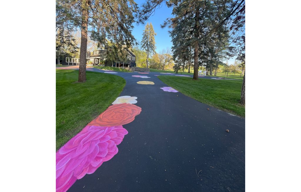 Wedding Entrance Driveway Mural, 2024, Hopkins, Minnesota. This mural was painted on a residential home driveway specifically for the family’s backyard wedding. This permanent mural provided an immersive experience for wedding guests to walk across the colorful flowers throughout the ceremony, cocktail hour and reception.